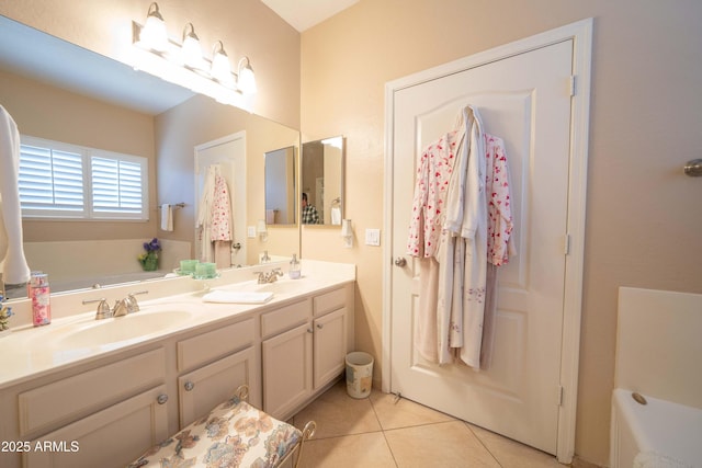 bathroom featuring vanity, tile patterned flooring, and a bathing tub