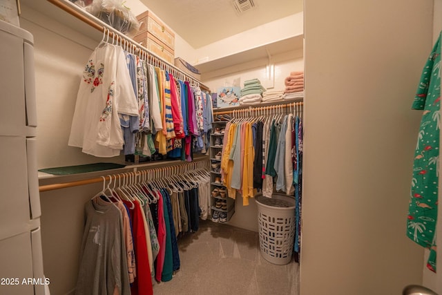 spacious closet featuring carpet floors