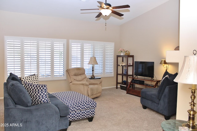 living room featuring light carpet, ceiling fan, and plenty of natural light