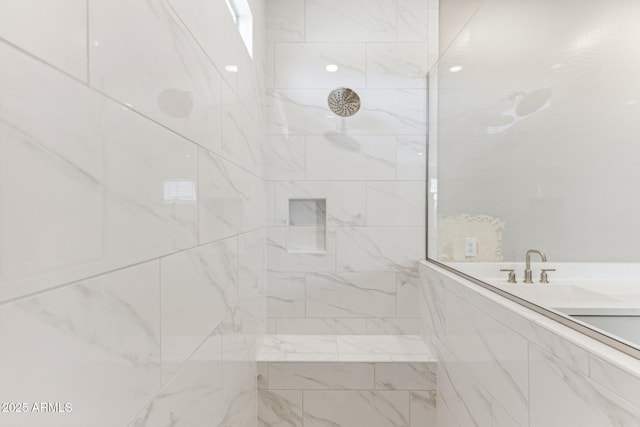 full bath with a tile shower