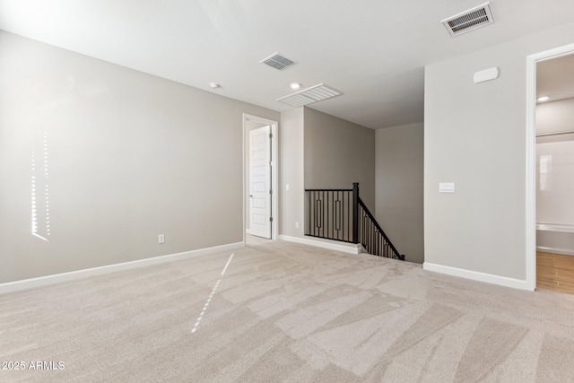 empty room with light carpet and visible vents