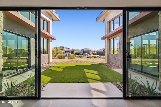 doorway to outside featuring tile patterned flooring