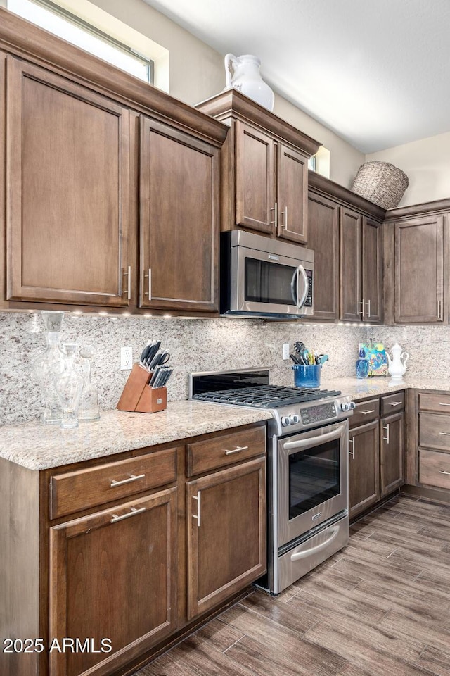 1822 N Waverly, Mesa, AZ 85207 - kitchen with stainless steel appliances, dark wood finished floors, tasteful backsplash, and light stone countertops
