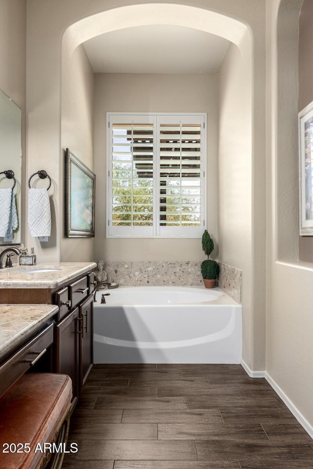 1822 N Waverly, Mesa, AZ 85207 - full bath with vanity, a garden tub, and wood finished floors