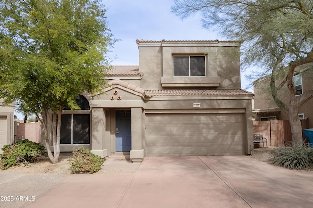 mediterranean / spanish-style home with a garage