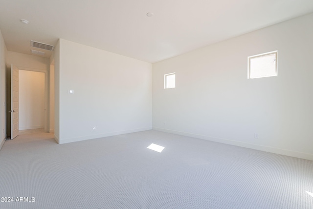 unfurnished room with light colored carpet