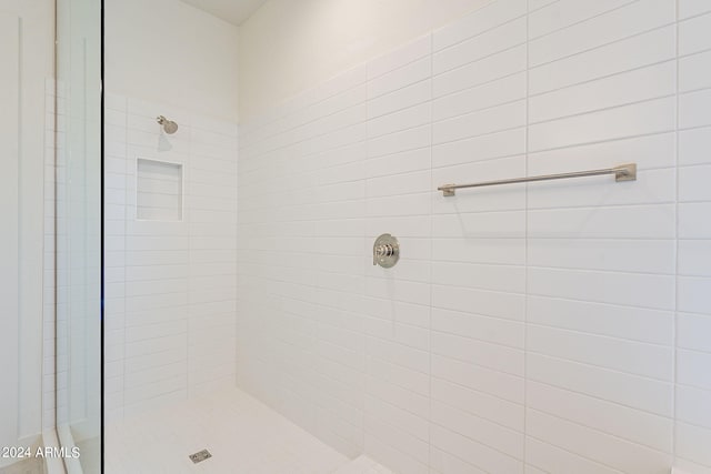 bathroom with tiled shower