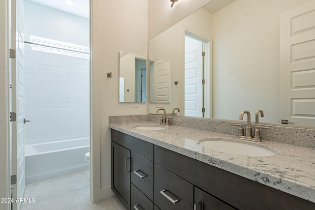 bathroom with tile patterned floors, vanity, and toilet