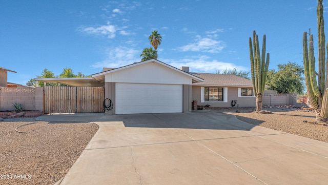 single story home with a carport and a garage