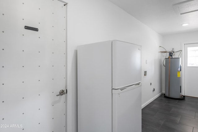 interior space featuring white refrigerator and electric water heater