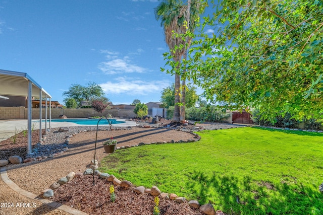 view of yard featuring a fenced in pool