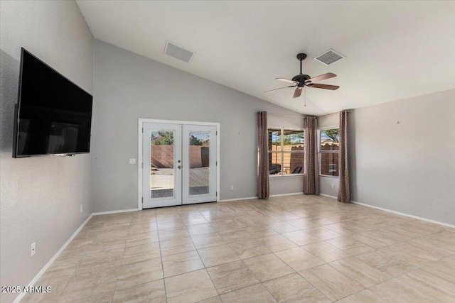 empty room featuring vaulted ceiling, french doors, a ceiling fan, light tile patterned floors, and baseboards