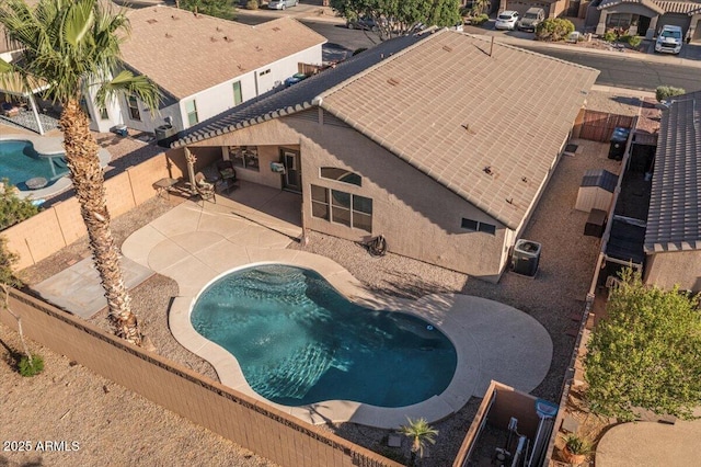 view of swimming pool featuring central AC unit and a patio area