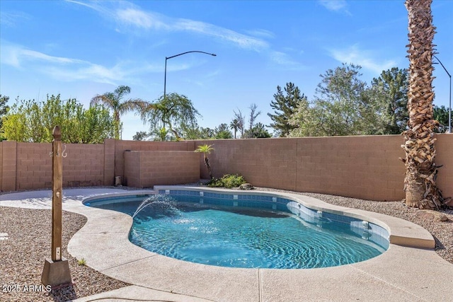 view of swimming pool featuring a fenced backyard
