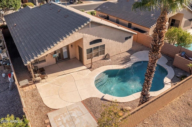 view of pool featuring a patio area and a fenced backyard
