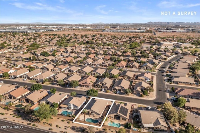 aerial view of property and surrounding area with mountains, property boundaries highlighted, and nearby suburban area