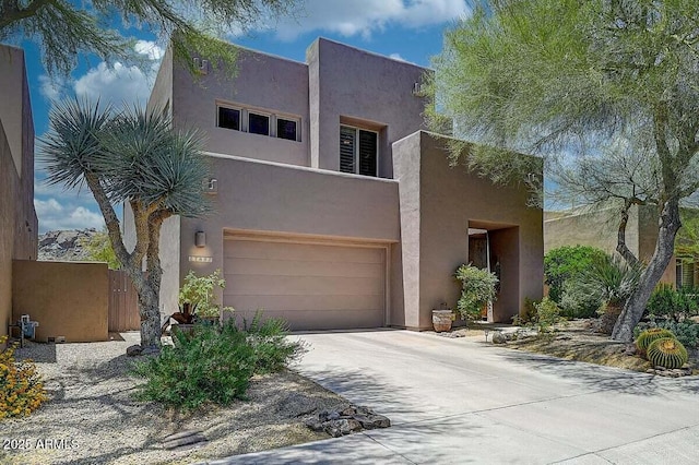 27892 N 108th Way, Scottsdale, AZ 85262 - southwest-style home featuring a garage, driveway, and stucco siding