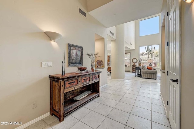 27892 N 108th Way, Scottsdale, AZ 85262 - corridor with a high ceiling, light tile patterned flooring, and baseboards