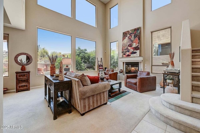 27892 N 108th Way, Scottsdale, AZ 85262 - living area with stairs, carpet flooring, a towering ceiling, and plenty of natural light