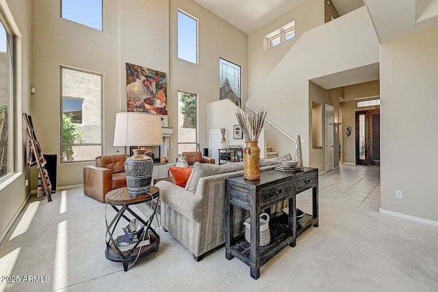 27892 N 108th Way, Scottsdale, AZ 85262 - living room with light colored carpet, a towering ceiling, a fireplace, and baseboards