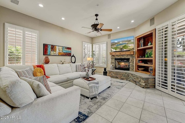 27892 N 108th Way, Scottsdale, AZ 85262 - living room with tile patterned floors, ceiling fan, a stone fireplace, recessed lighting, and healthy amount of natural light