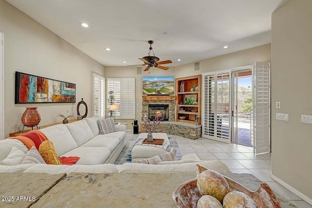 27892 N 108th Way, Scottsdale, AZ 85262 - tiled living room with plenty of natural light, baseboards, a ceiling fan, recessed lighting, and a stone fireplace