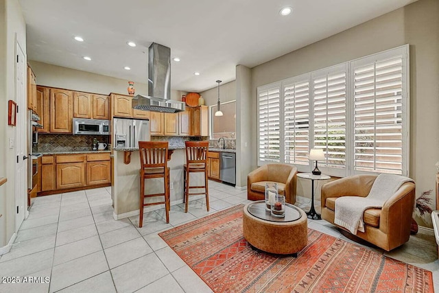 27892 N 108th Way, Scottsdale, AZ 85262 - kitchen featuring stainless steel appliances, decorative backsplash, light tile patterned floors, a kitchen bar, and recessed lighting