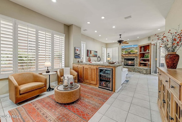 27892 N 108th Way, Scottsdale, AZ 85262 - kitchen with wine cooler, light tile patterned floors, recessed lighting, ceiling fan, and a stone fireplace