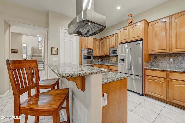 27892 N 108th Way, Scottsdale, AZ 85262 - kitchen with stainless steel appliances, wall chimney range hood, light tile patterned flooring, light stone counters, and recessed lighting