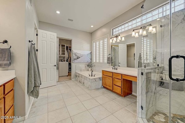 27892 N 108th Way, Scottsdale, AZ 85262 - bathroom with vanity, a bath, a shower stall, tile patterned floors, and recessed lighting