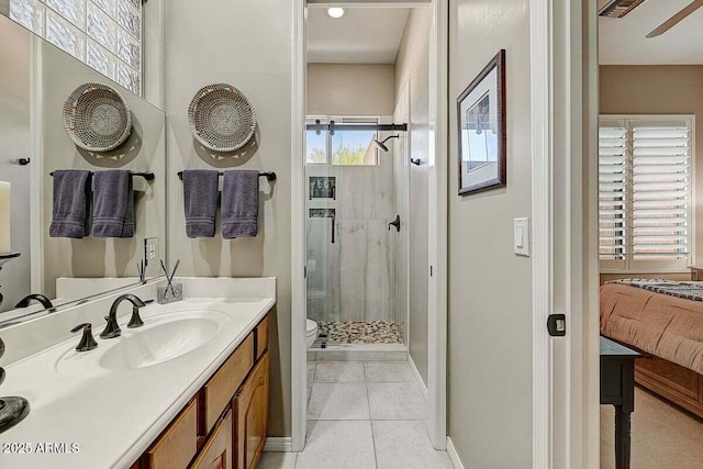 27892 N 108th Way, Scottsdale, AZ 85262 - bathroom featuring toilet, a stall shower, vanity, tile patterned flooring, and ensuite bathroom