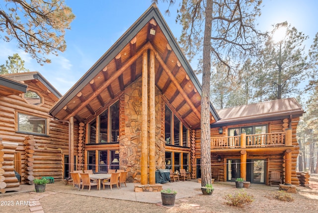 rear view of house featuring a patio