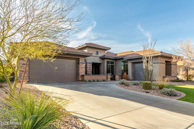 prairie-style home featuring a garage