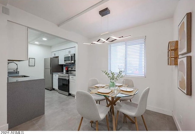 dining space featuring sink