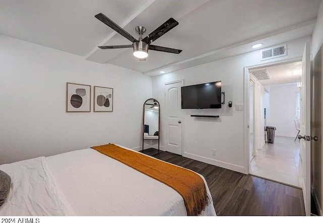 bedroom featuring ceiling fan and dark hardwood / wood-style floors