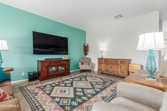 living area with visible vents and baseboards