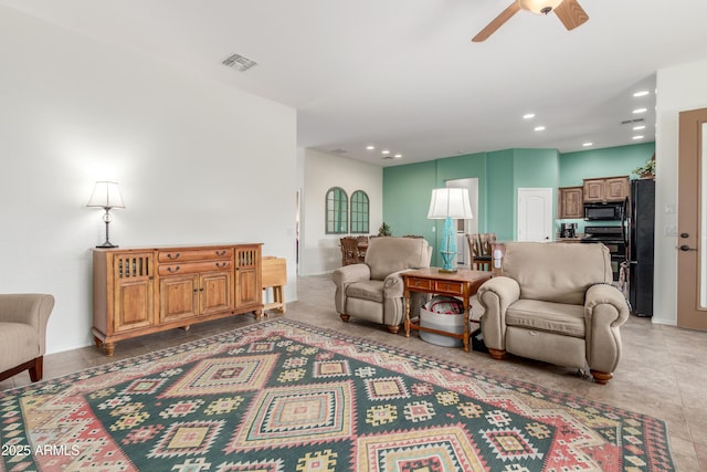 living room with recessed lighting, visible vents, baseboards, and a ceiling fan