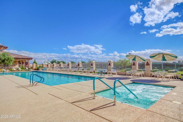 pool featuring a patio and fence