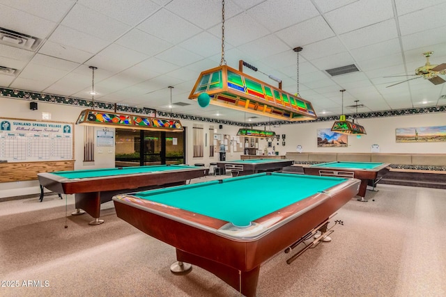 recreation room with a drop ceiling and visible vents