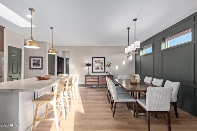 dining room with light hardwood / wood-style floors