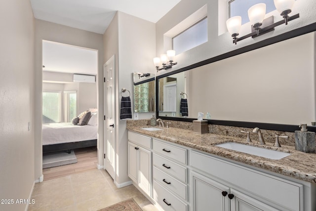 bathroom with tile patterned floors and vanity