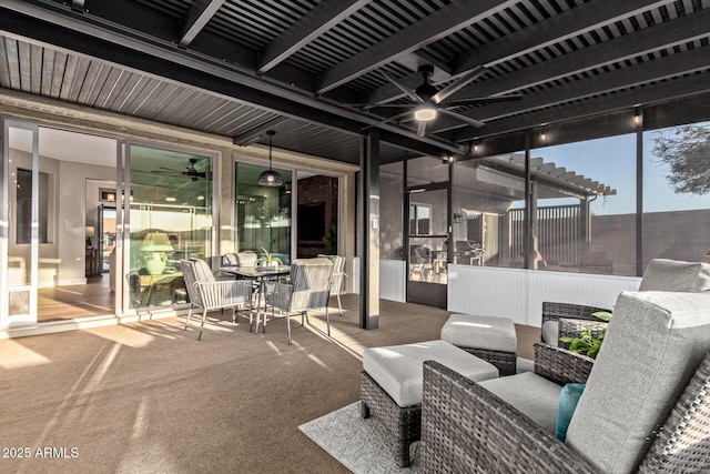 patio terrace at dusk with a pergola, an outdoor hangout area, and ceiling fan