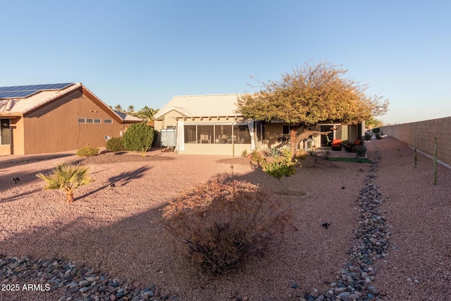 exterior space featuring a sunroom