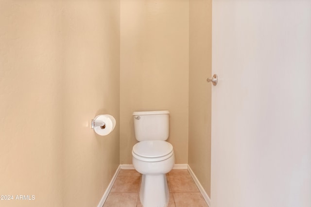 bathroom featuring tile patterned floors and toilet