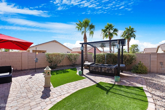 view of yard featuring a patio, outdoor lounge area, and a pergola