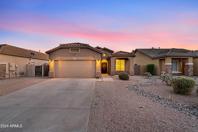 view of front of property with a garage