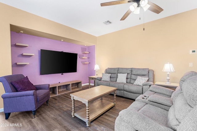 living room with dark hardwood / wood-style flooring and ceiling fan