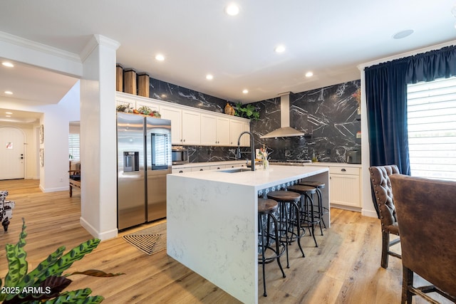 20639 W Grandview Dr, Buckeye, AZ 85396 - kitchen with stainless steel appliances, wall chimney range hood, a sink, backsplash, and recessed lighting