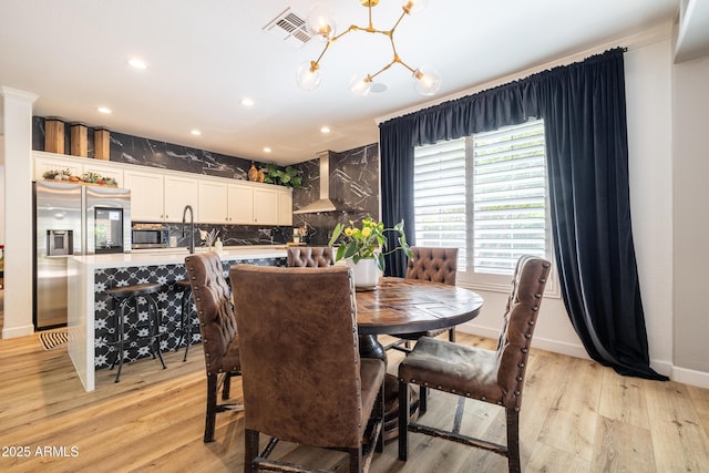 20639 W Grandview Dr, Buckeye, AZ 85396 - dining space with a chandelier, light wood-type flooring, and recessed lighting