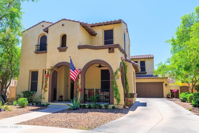 20639 W Grandview Dr, Buckeye, AZ 85396 - mediterranean / spanish house featuring stucco siding, a tile roof, an attached garage, and fence